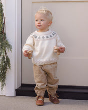 Load image into Gallery viewer, Toddler wearing latte tan pants with a cream tree Fair Isle sweater and brown lace-up boots.