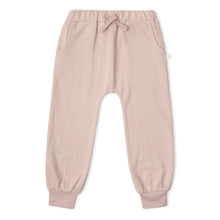 Load image into Gallery viewer, A pair of dusty pink jogger pants for toddlers, featuring an elastic waistband with a matching fabric bow, side pockets, and ribbed ankle cuffs, shown flat on a white background.