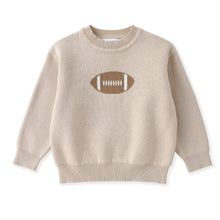 Load image into Gallery viewer, A beige knit crewneck sweater with a brown and white knitted football graphic on the chest, displayed flat against a white background.