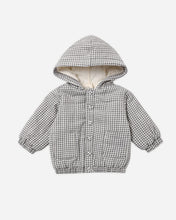 Load image into Gallery viewer, A children's hooded jacket with a black and white gingham pattern, featuring a soft cream-colored fleece lining inside the hood and front pockets, shown on a plain light gray background.