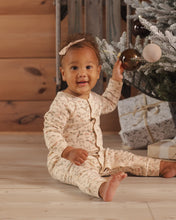 Load image into Gallery viewer, Organic Long John Pajamas in Holly Fleur on a smiling seated baby