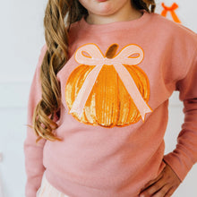 Load image into Gallery viewer, Child wearing a pink sweatshirt with a sequin pumpkin design on a white background