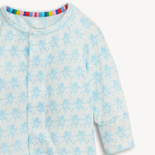 Load image into Gallery viewer, A close-up of a baby long-sleeve sleep sack or pajama top in white with a light blue angel pattern, featuring a colorful striped inner collar.