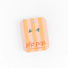 Load image into Gallery viewer, Blue ombré gem stud earrings displayed on a pink and peach striped Pip Pop card.