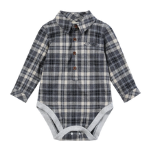 Load image into Gallery viewer, A baby long-sleeve romper in a navy, gray, and beige plaid pattern, styled like a button-down shirt with brown buttons and a light gray snap-closure bottom.