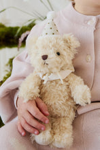 Load image into Gallery viewer, Close-up of Party Arthur teddy bear on a child’s lap, showing its brown nose, cream bow, and gold-dotted party hat.