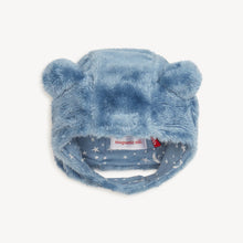 Load image into Gallery viewer, Winter Sky blue plush bear hat with its magnetic chin strap fastened and moon-and-star lining visible.