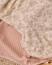 Load image into Gallery viewer, A close-up of a soft textile product showing two layers: a pale blush pink waffle-knit texture underneath and a cream-colored top layer with a delicate pink and beige floral print.