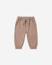 Load image into Gallery viewer, A pair of toddler jogger pants in a muted taupe-brown color, featuring an elastic waistband with a drawstring and button closure, elastic cuffs, and side pockets, shown against a plain light gray background.