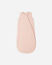 Load image into Gallery viewer, A pale pink sleeveless baby sleep sack with an asymmetrical zipper, shown flat against a light gray background.