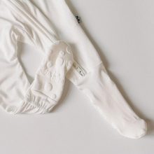 Load image into Gallery viewer, White baby pants with footies on a light gray background