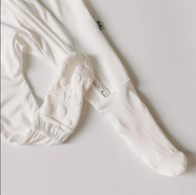 Load image into Gallery viewer, White baby pants with footies on a light gray background