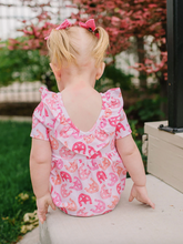 Load image into Gallery viewer, Child wearing a pink romper with a blurred outdoor background
