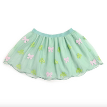 Load image into Gallery viewer, Green skirt with pink bows and green four-leaf clovers patterns on a white background