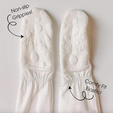 Load image into Gallery viewer, White footies with non-slip grippies and comfy fit elastic on a light gray background