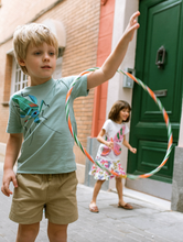 Load image into Gallery viewer, Child playing with a hula hoop on a street
