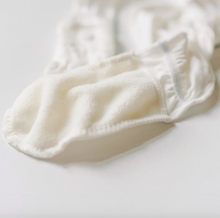 Load image into Gallery viewer, White baby footies on a light gray background