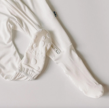 Load image into Gallery viewer, White baby footies with textured sole on a light gray background