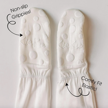 Load image into Gallery viewer, White footies with text highlighting non-slip grippies and comfy fit elastic on a light gray background