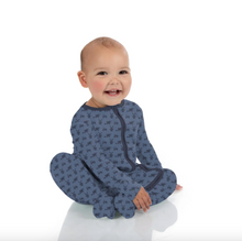 Load image into Gallery viewer, Baby wearing a blue onesie with a pattern on a white background