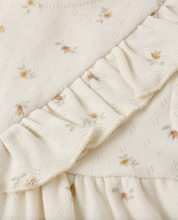 Load image into Gallery viewer, Close-up of a textured fabric with floral patterns on a light background