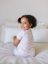 Load image into Gallery viewer, Child sitting on a bed