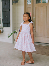 Load image into Gallery viewer, Young girl in a pink dress standing on a porch