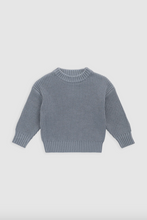 Load image into Gallery viewer, Blue knitted sweater on a light gray background