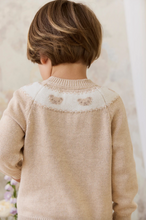 Load image into Gallery viewer, Child wearing a beige knitted sweater on a neutral background