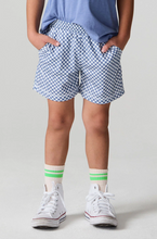 Load image into Gallery viewer, Person wearing blue checkered shorts and white sneakers with green accents on a plain background