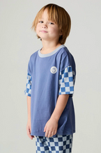 Load image into Gallery viewer, A young boy wearing a blue short-sleeve t-shirt with a light gray collar and blue-and-white checkered sleeve patterns, paired with matching checkered pants, against a plain light gray background.