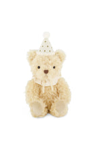 Load image into Gallery viewer, Front view of Snuggle Bunnies Party Arthur, an ivory teddy bear wearing a gold-dotted party hat and cream ribbon bow.
