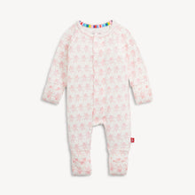 Load image into Gallery viewer, A baby long-sleeve footless one-piece sleeper in white with a light pink teddy bear pattern, featuring a colorful striped inner collar and a small red tag on the leg.