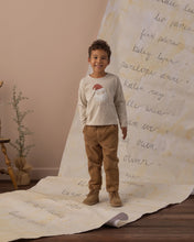 Load image into Gallery viewer, Long Sleeve Tee in Santa, cream on a boy, standing
