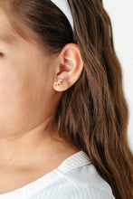 Load image into Gallery viewer, Close-up of a child wearing a gold-tone crawler stud earring with clear marquise-shaped stones.