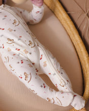 Load image into Gallery viewer, Close-up of the Toy Chest footie’s enclosed feet and zipper extending down one leg.