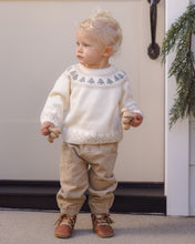 Load image into Gallery viewer, Toddler wearing a cream tree Fair Isle sweater with tan pants and brown boots, holding wooden toys.