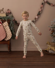 Load image into Gallery viewer, Organic Long Sleeve PJ Set in Gnome Village on a boy, standing by stockings