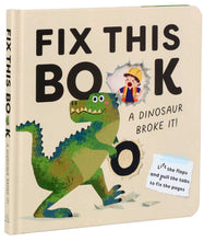 Load image into Gallery viewer, A children's hardcover book titled 'FIX THIS BOOK: A DINOSAUR BROKE IT!' with a cream cover, large black text, a green dinosaur illustration, and a torn-paper inset showing a child in a yellow hard hat.