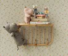 Load image into Gallery viewer, Soft rose Maileg hippo beside two mice at a miniature tea table on a wooden wall shelf, with a gray rhino hanging below.
