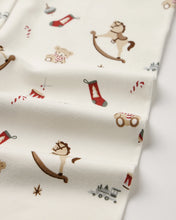Load image into Gallery viewer, Close-up of the Toy Chest print, showing rocking horses, teddy bears, red stockings, drums, and trains on cream fabric.

