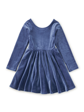Load image into Gallery viewer, A long-sleeve velvet dress in a dusty medium blue color, featuring a scoop neckline and a gathered flared skirt, shown against a plain white background.
