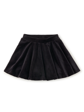 Load image into Gallery viewer, A black pleated skirt made of a soft velvet-like fabric, shown flat against a plain white background.
