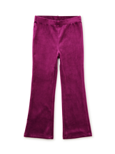 Load image into Gallery viewer, A pair of magenta velvet flare leggings shown flat against a solid white background.
