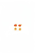 Load image into Gallery viewer, Pair of red ladybug stud earrings with gold-tone outlines and dotted wing details, showing the posts and round flat backs on a white background.
