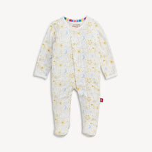 Load image into Gallery viewer, A baby footed one-piece sleeper with a white background and a celestial print of gold stars, blue crescent moons, and small clouds. The long-sleeve sleeper features a colorful striped inner collar and a small red tag on the lower leg, shown against a plain off-white background.
