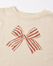 Load image into Gallery viewer, Ruffle Long Sleeve Tee in Bow, cream, close-up of the striped bow graphic
