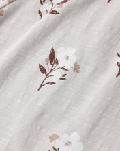 Load image into Gallery viewer, Close-up of a white textured fabric with a delicate floral print in brown and soft pink.
