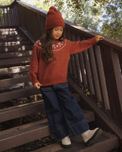 Load image into Gallery viewer, Beanie in Ruby Birdseye on a girl on outdoor stairs
