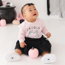 Load image into Gallery viewer, A baby girl sitting on a white floor wearing a light pink long-sleeve shirt with a black graphic print that says 'SHOULDS' and a black tulle tutu skirt. She is wearing white shoes with black stars and has a black bow headband.
